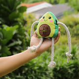 Puppy playing with soft Chewable Dog Toys on grass