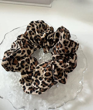 Leopard print scrunchies matching dog harness for dog mom