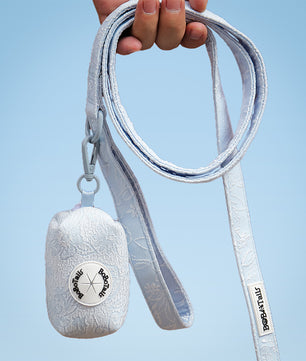 Morning Glory trash bag holder dispenser designed as part of a matching dog and owner accessory system for everyday walks