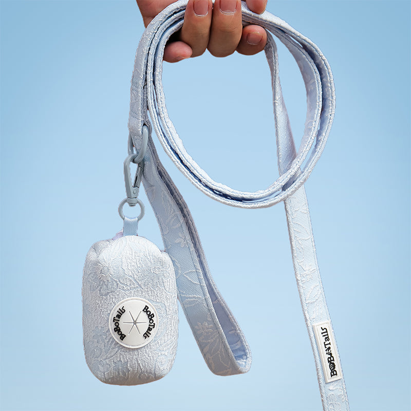 Morning Glory trash bag holder dispenser designed as part of a matching dog and owner accessory system for everyday walks