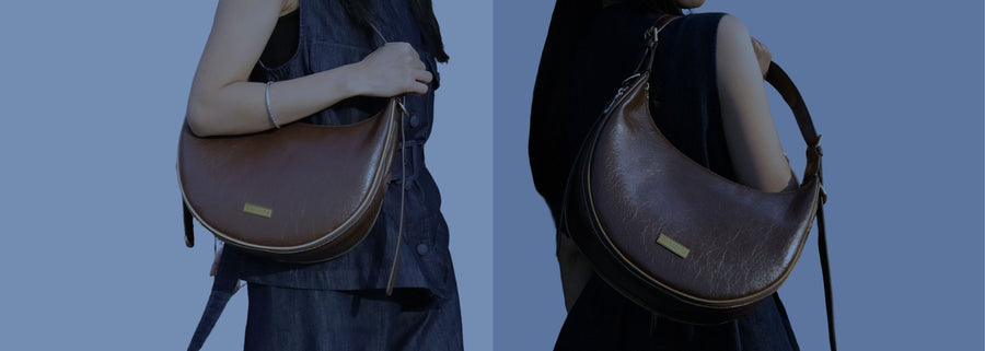 Deep Brown moon bag worn by a person on a blue background