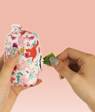 dinosaur printed dog waste bag holder matching the harness and owner accessories for daily dog walks