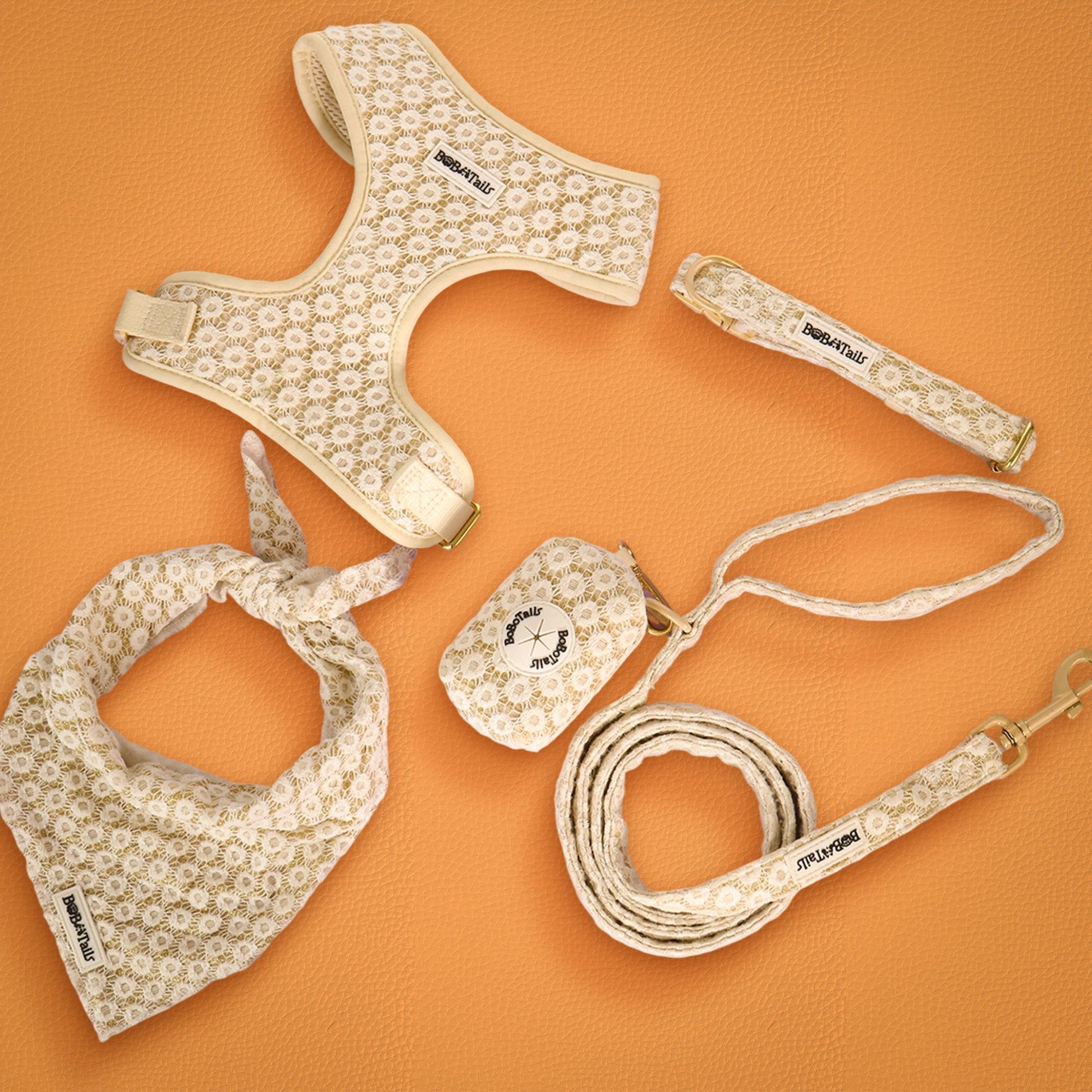 Dog harness, leash, and bandana set with floral pattern on an orange background-bobotails