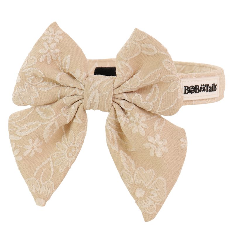 morning glory biscuit dog bow tie collars designed to match the harness and owner accessories in a coordinated system