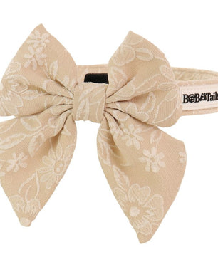 morning glory biscuit dog bow tie collars designed to match the harness and owner accessories in a coordinated system